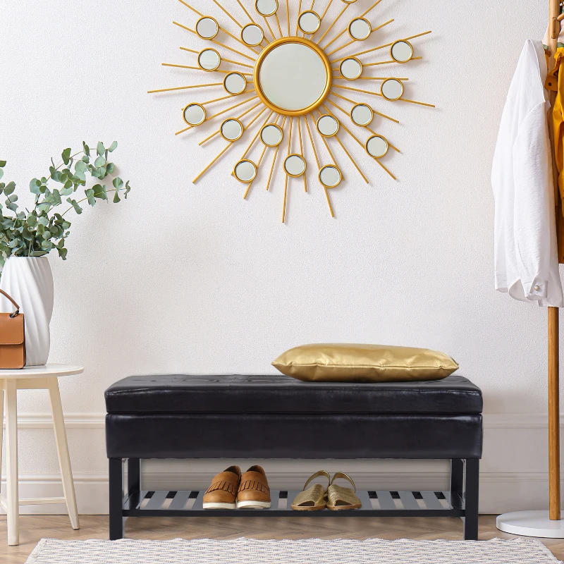 Entryway with black leather bench, gold pillow, and shoe rack.