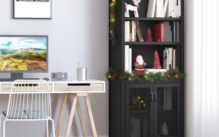 Black bookcase decorated with Christmas garland and ornaments in a home office.