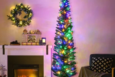 Small living room decorated for Christmas with tree.