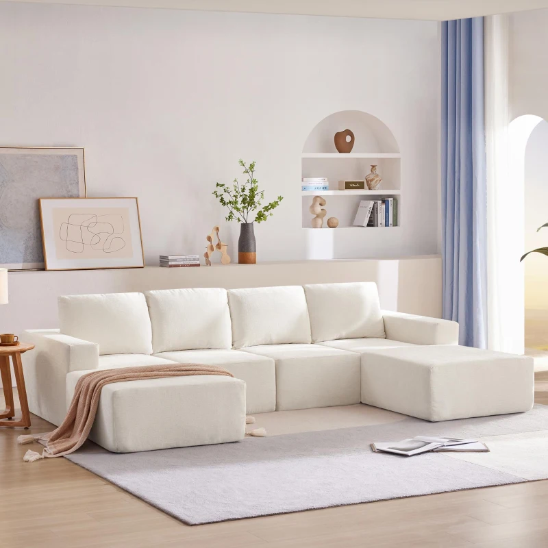 Cream U-shaped sectional sofa with ottoman in minimalist living room.