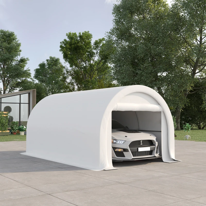 White rounded carport canopy covering car in open driveway.