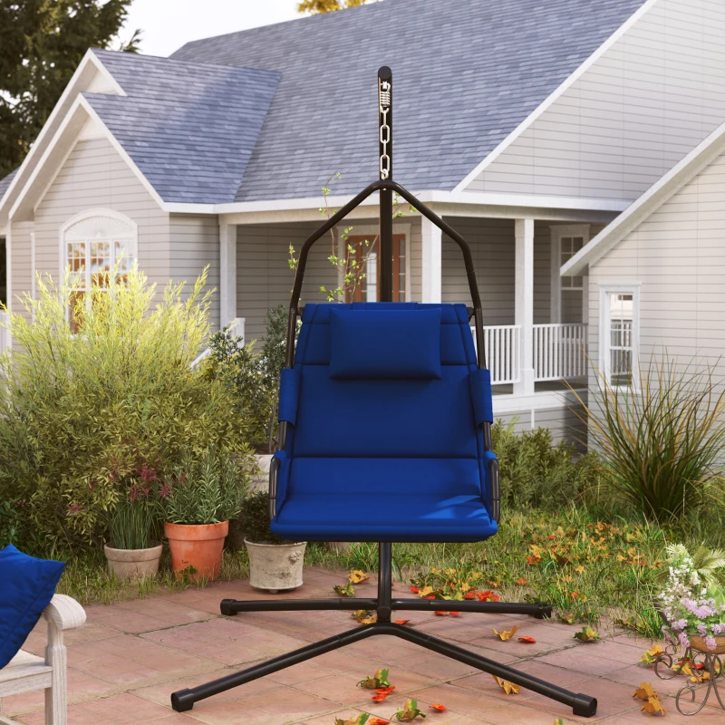 Blue cushioned hammock chair on stand in patio with plants.