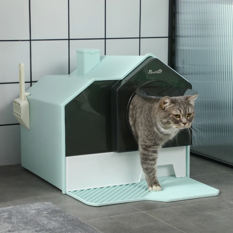 Cat exiting blue litter box with textured landing mat.