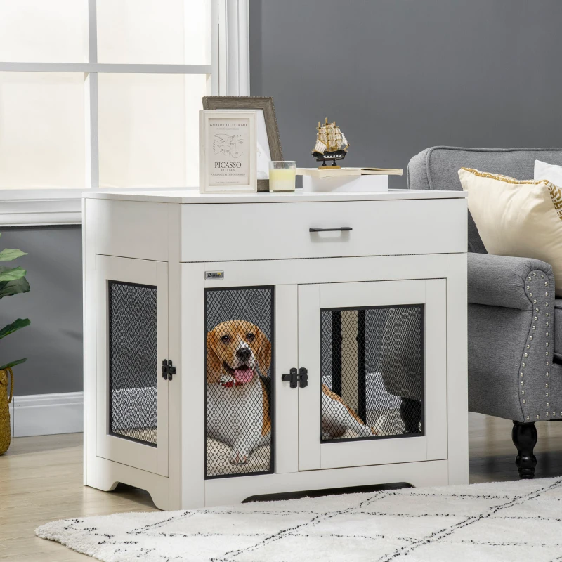 white furniture-style indoor dog crate with a dog relaxing inside the mesh-front enclosure.
