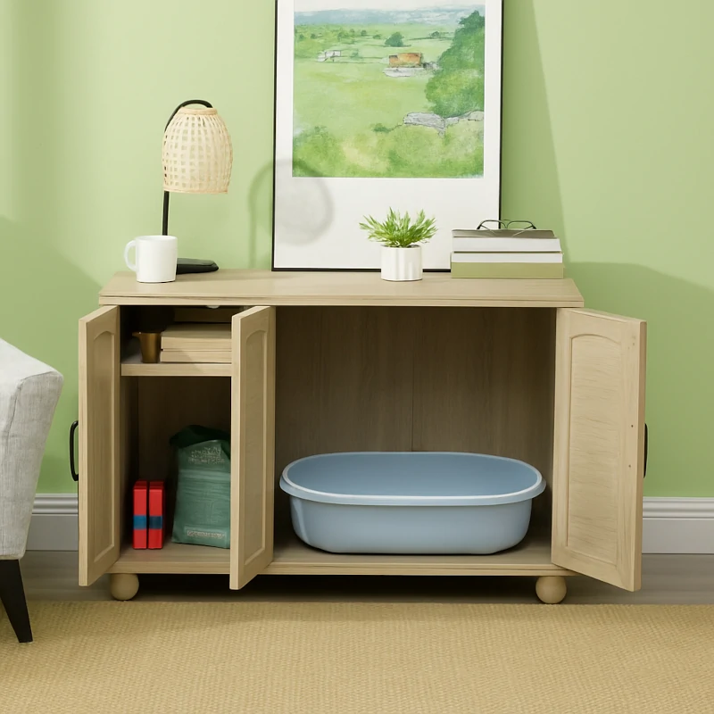 Cat resting inside rattan-style litter box cabinet in room.