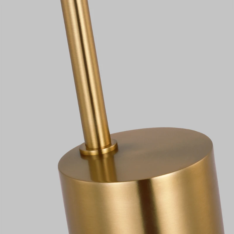 Close-up of gold metallic lamp base with smooth finish.