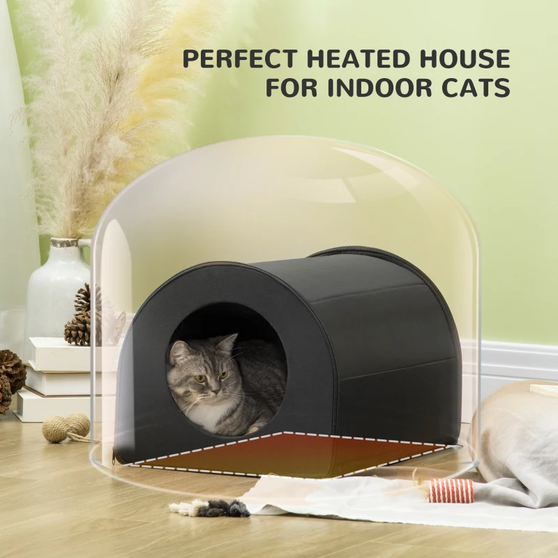 Cat resting inside a heated indoor cat house with a protective dome-style visual overlay.
