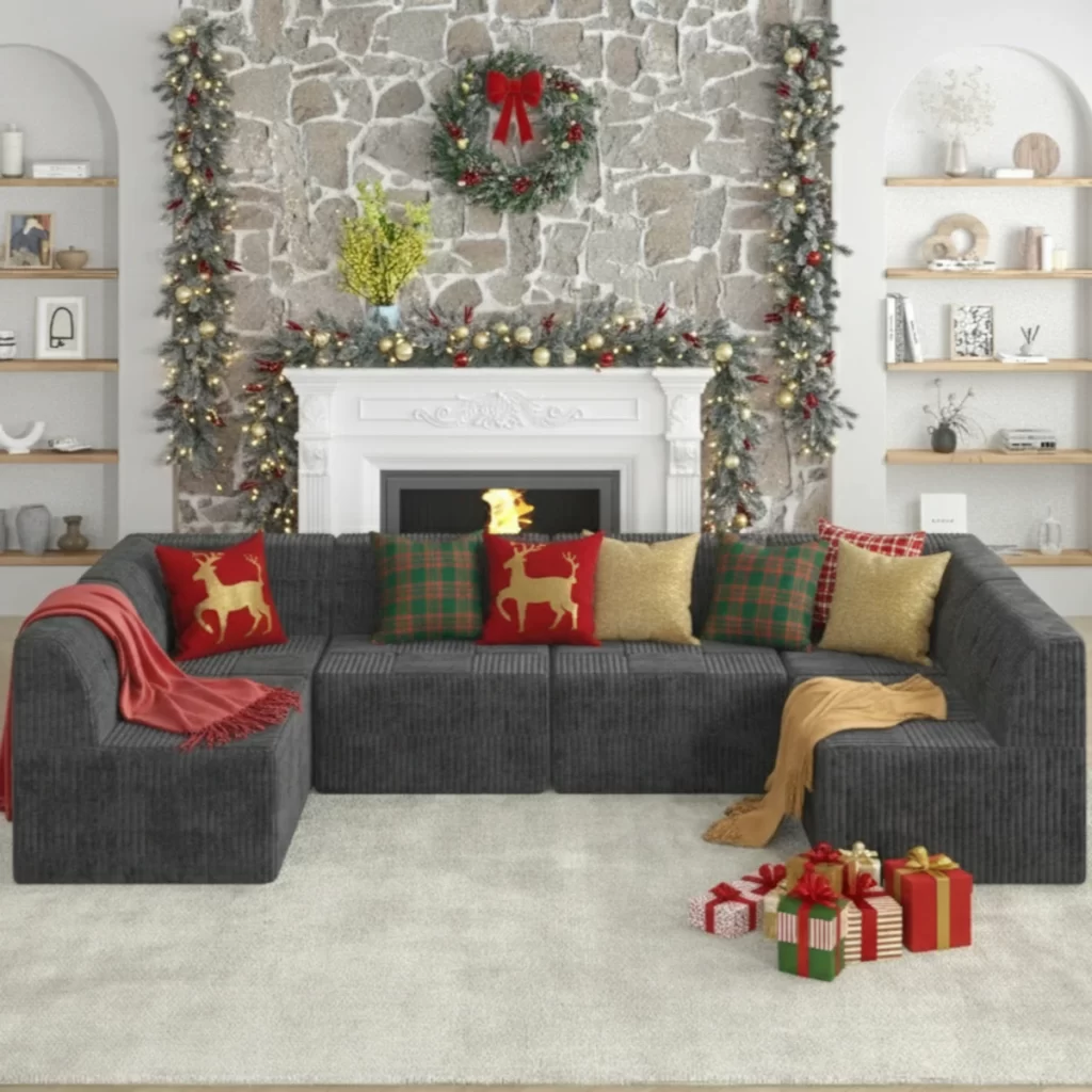 Dark sectional sofa with Christmas pillows, garland, wreath, and wrapped gifts.
