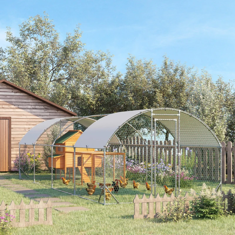 Large metal dome chicken run with a coop inside, free-range chickens in a backyard.
